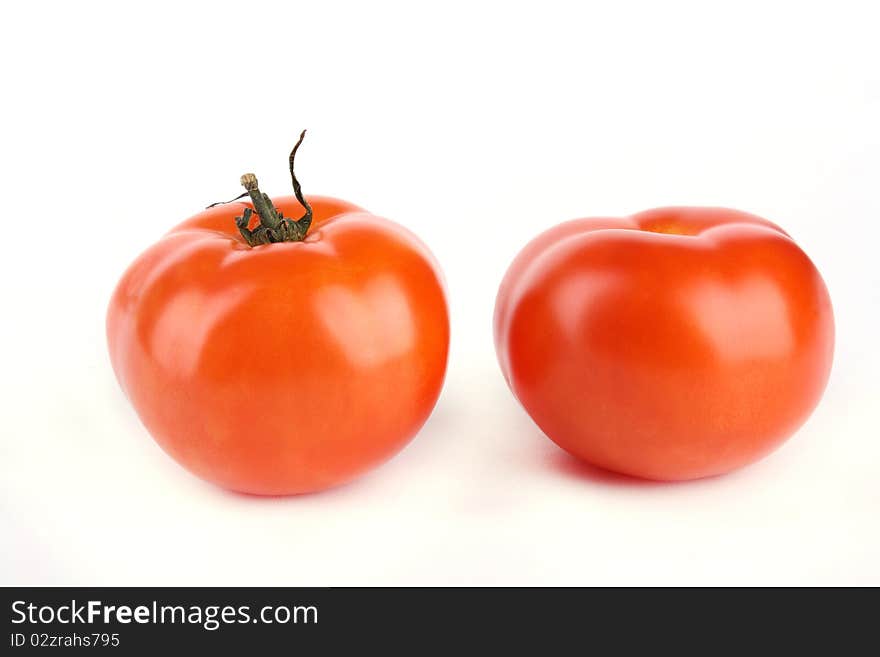 Close up two tomato isolated on white background