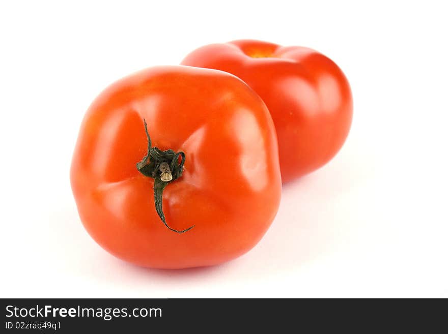 Close up two tomato isolated on white background