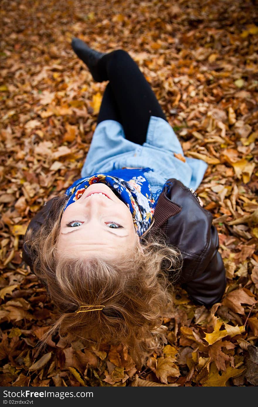 Young caucasian student girl in golden autumn park. Young caucasian student girl in golden autumn park