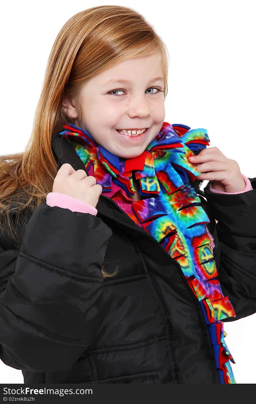 Beautiful 5 year old girl with blond hair blue eyes wearing winter coat and colorful scarf. Beautiful 5 year old girl with blond hair blue eyes wearing winter coat and colorful scarf.