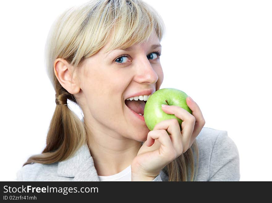 Portrait of smiling blonde girl with green apple on the white background. Portrait of smiling blonde girl with green apple on the white background