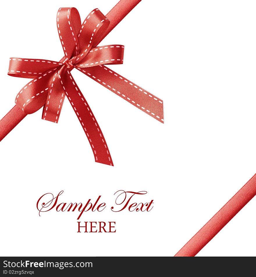 Shiny red satin ribbon on white background with copy space