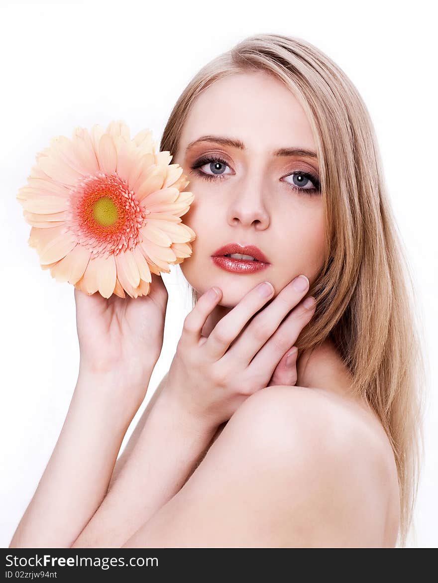 Skincare of young beautiful woman face with flower against white background