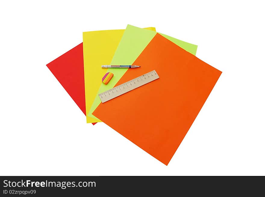 Four colourful papers, pencil, ruler and eraser isolated on white