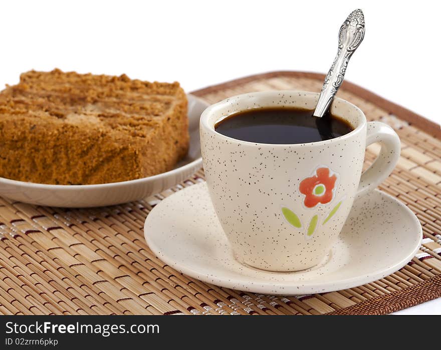 Cup of coffee with the honey cake. Cup of coffee with the honey cake.