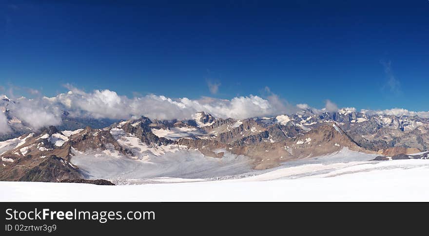 Mountain array with cloud and blue sky. Panorama