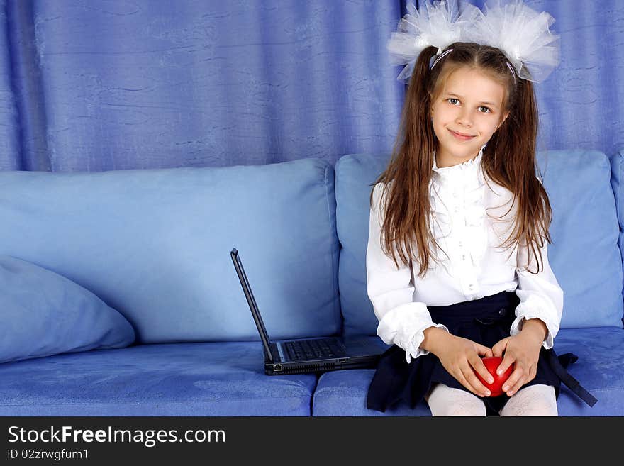 Schoolgirl With Laptop And Red Apple