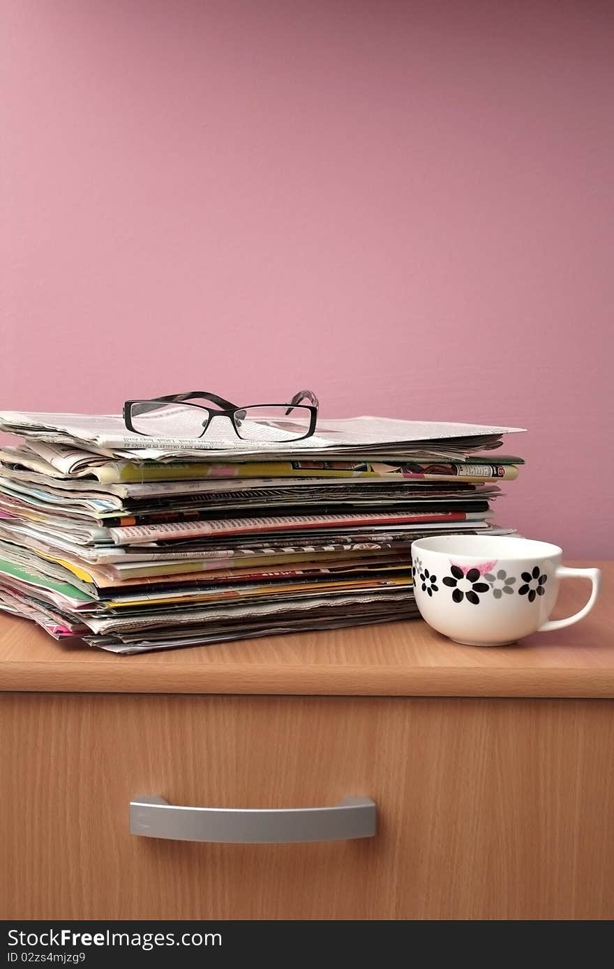 Pile of newspapers in office