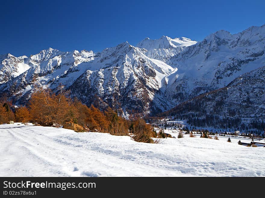 Tonale Pass at 1884 meters on the sea-level, after a fall snowfall. Trento province, Trentino-Alto Adige region, Italy. Tonale Pass at 1884 meters on the sea-level, after a fall snowfall. Trento province, Trentino-Alto Adige region, Italy