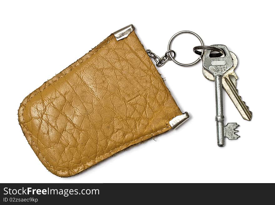 Keys and leather tag isolated on white background. Keys and leather tag isolated on white background