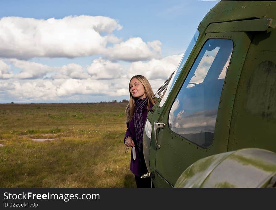 The girl the helicopter the sky