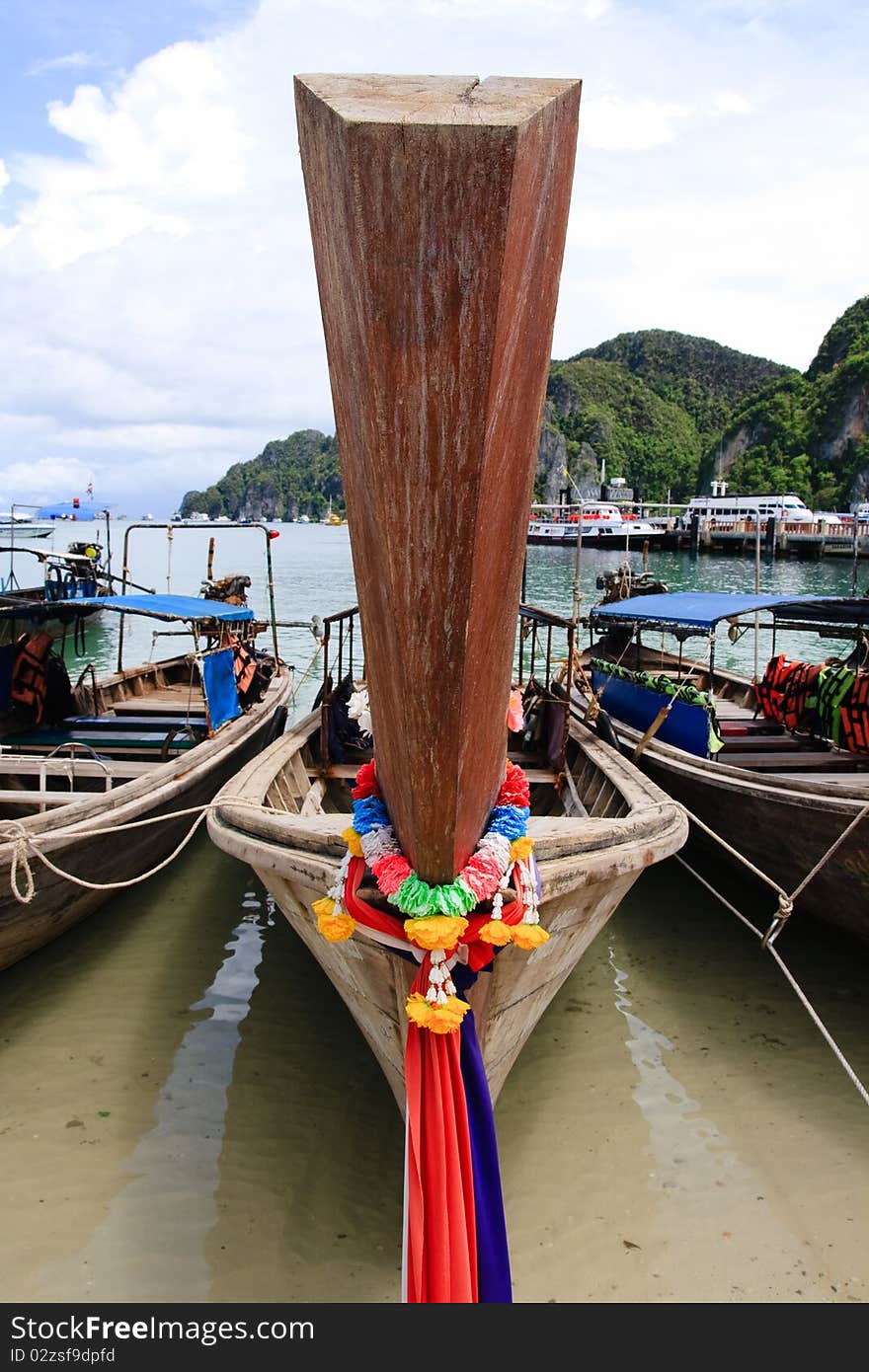 Long tail boat front, decorated with colorful ribbons, Thailand