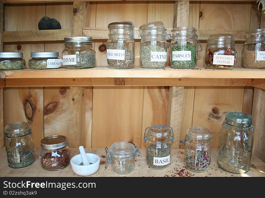 Dried herbs in bunches and jars for culinary and spa use. Dried herbs in bunches and jars for culinary and spa use