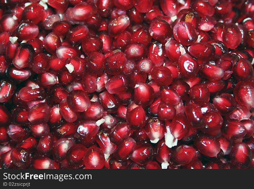 Juicy red pomegranate seeds for texture or background. Juicy red pomegranate seeds for texture or background