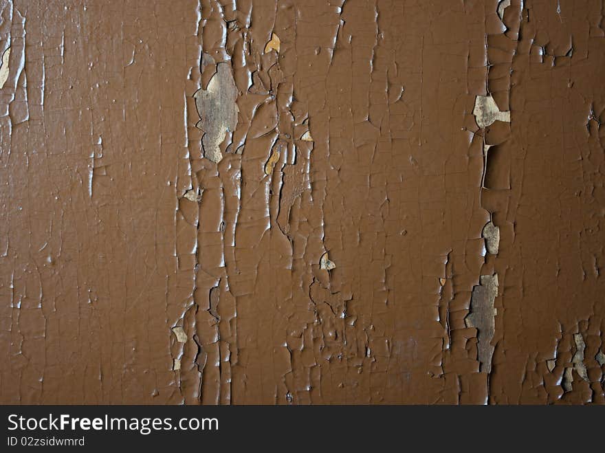 An old crackled painted wood surface. An old crackled painted wood surface