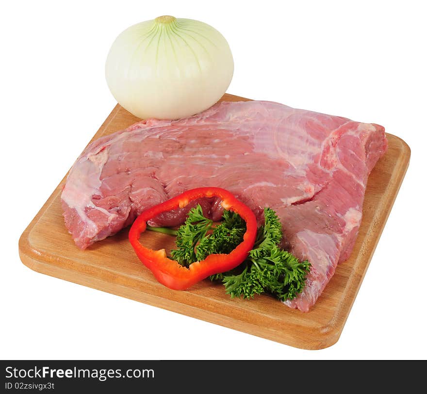 Meat and vegetables on a cutting board. Meat and vegetables on a cutting board.