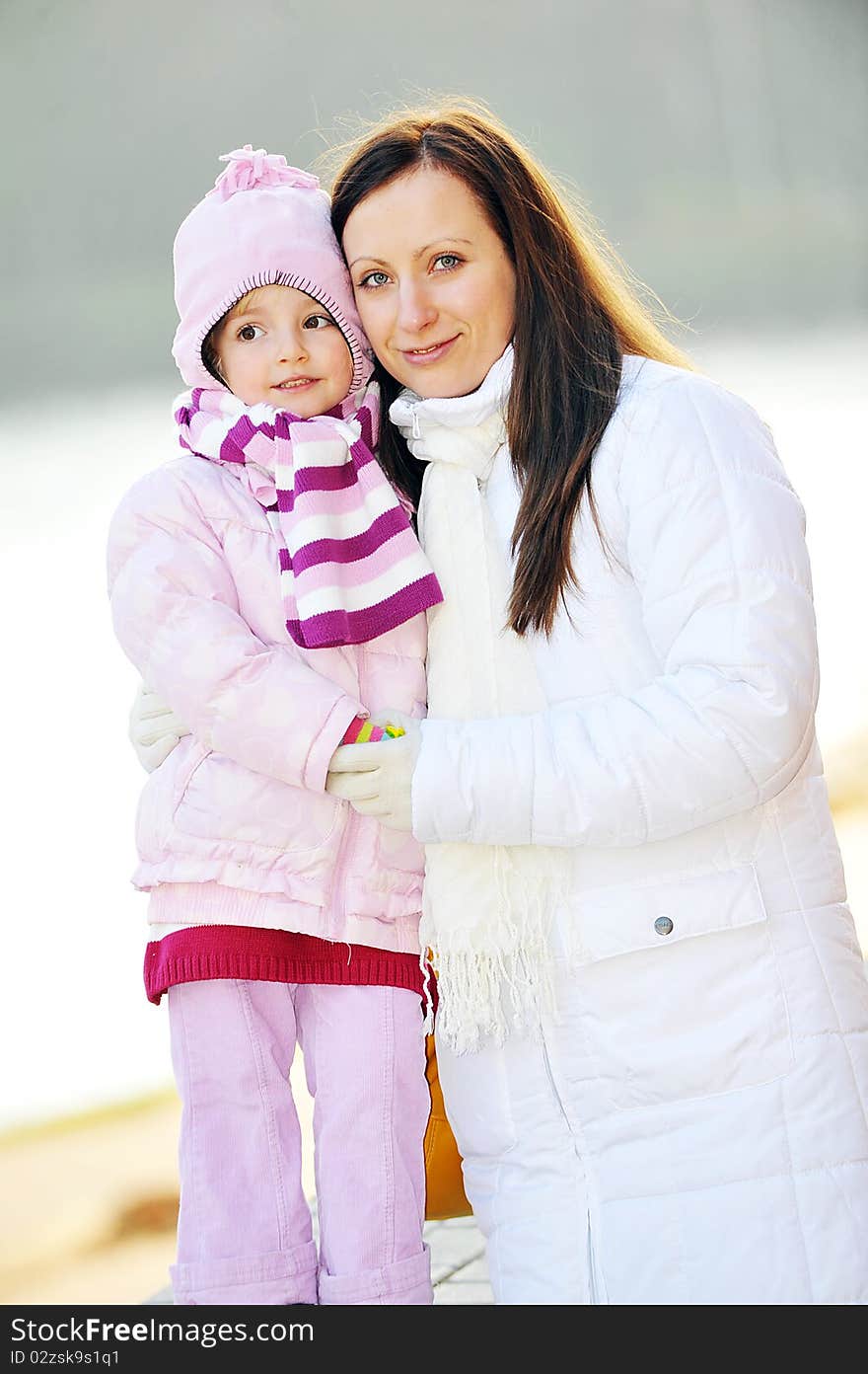 Young mother with daughter. Autumn day. Young mother with daughter. Autumn day