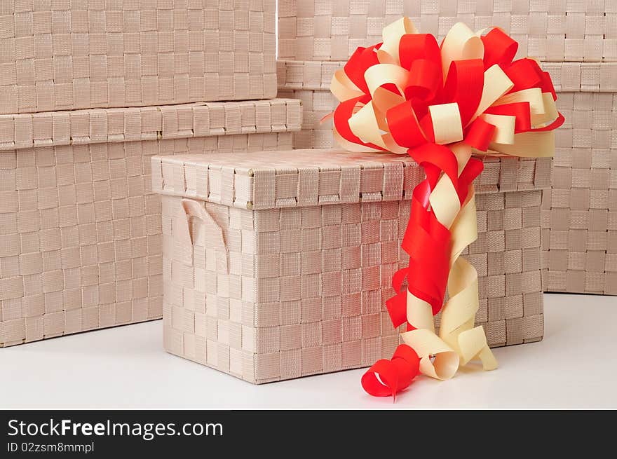 Christmas ribbon over stack of boxes. Christmas ribbon over stack of boxes.