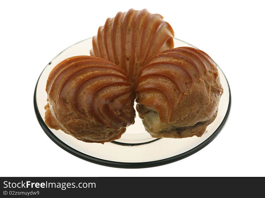 Eclairs on a plate, isolated on a white background