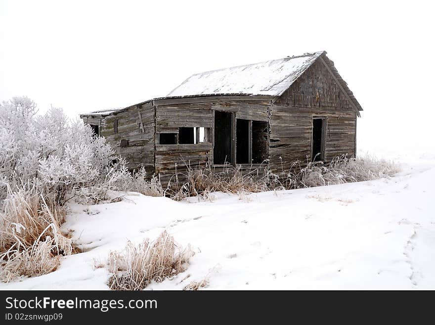 Abandoned Wood Farm Building in Winter