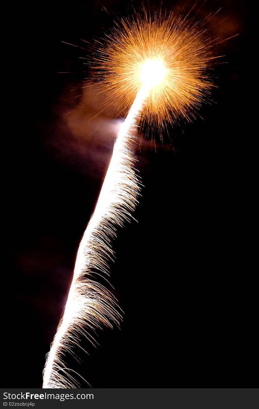 Brightly coloured fireworks against a black night sky