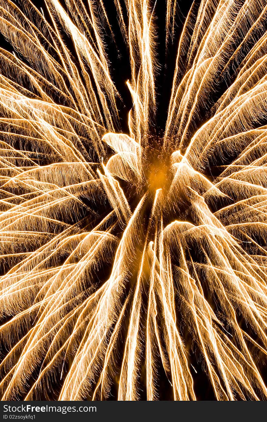 Brightly coloured fireworks against a black night sky