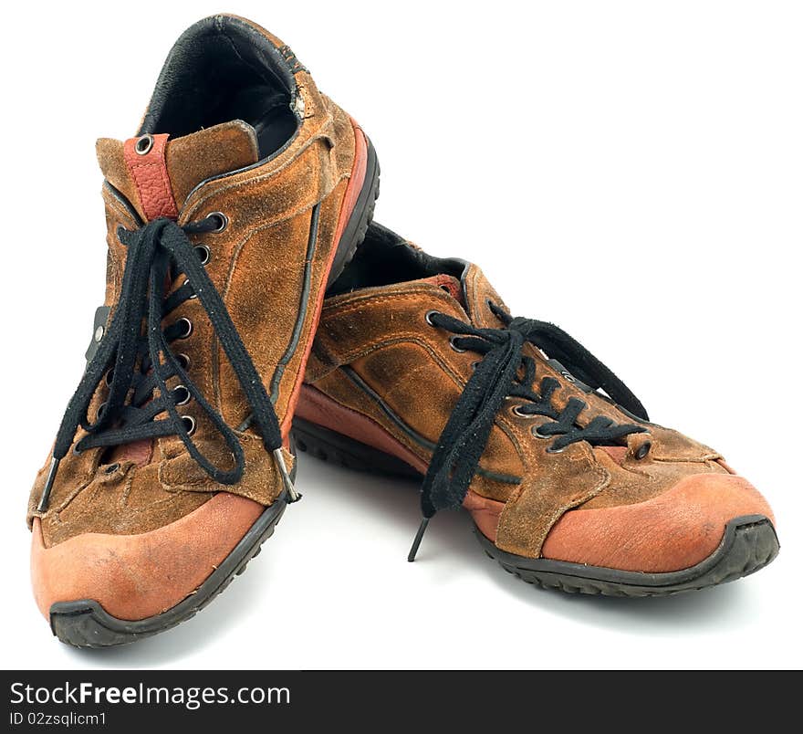 Studio shot of old sneakers on white background. Studio shot of old sneakers on white background