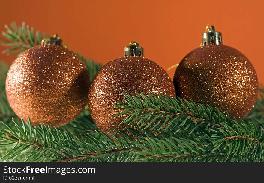 Christmas decoration, bronze christmas balls on spruce branch