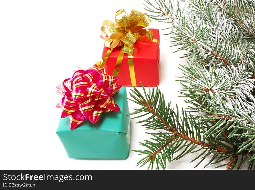 Gifts on fur-tree branches are isolated on a white background