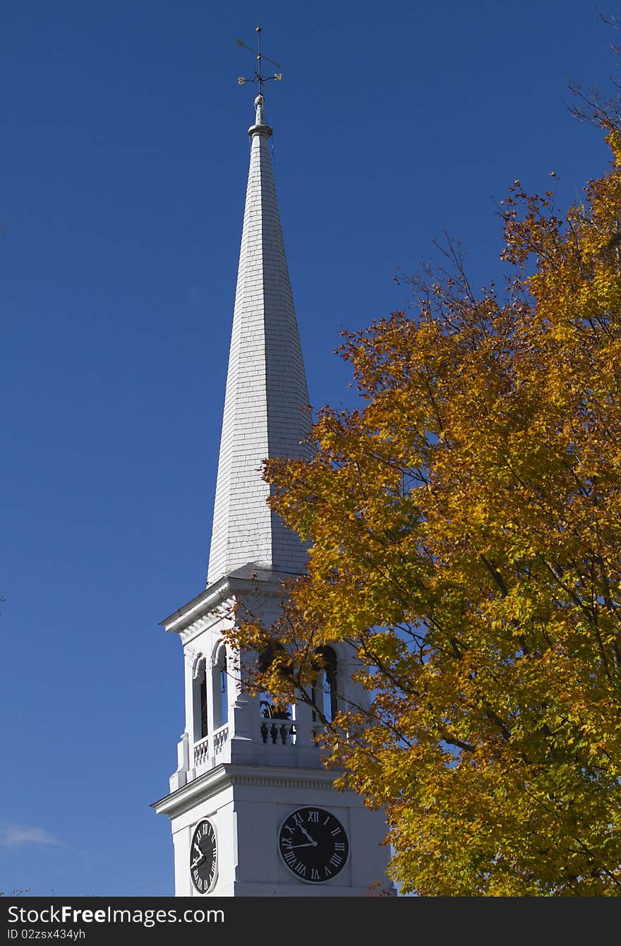 A Congregational church steeple thrusts above the fall foliage in Peacham, Vermont. A Congregational church steeple thrusts above the fall foliage in Peacham, Vermont.