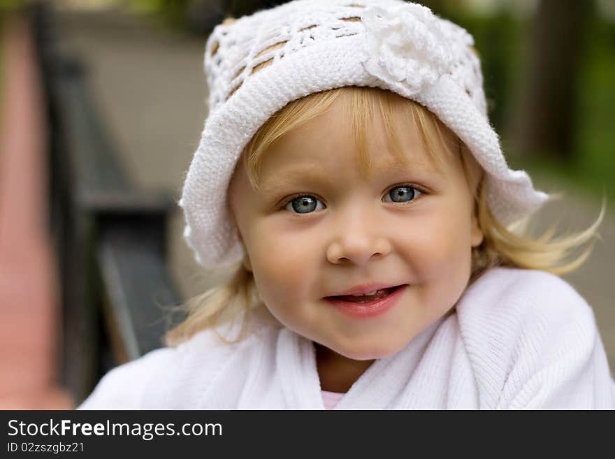 Happy little girl smiling blonde. Happy little girl smiling blonde