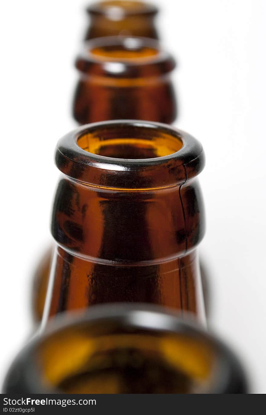 Brown bottle placement in a row on a white background