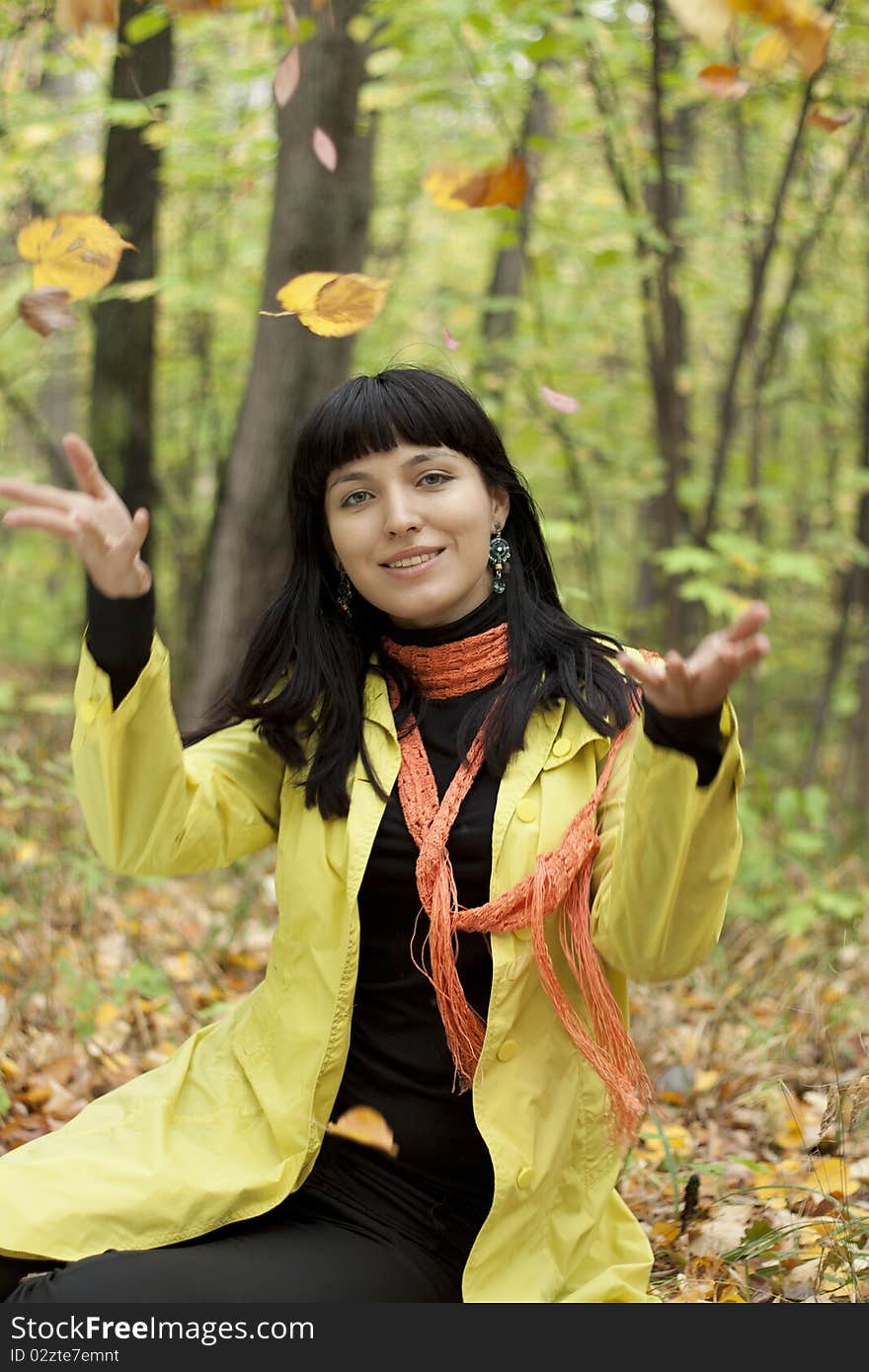 Beautiful Girl With Falling Leaves In The Autumn P