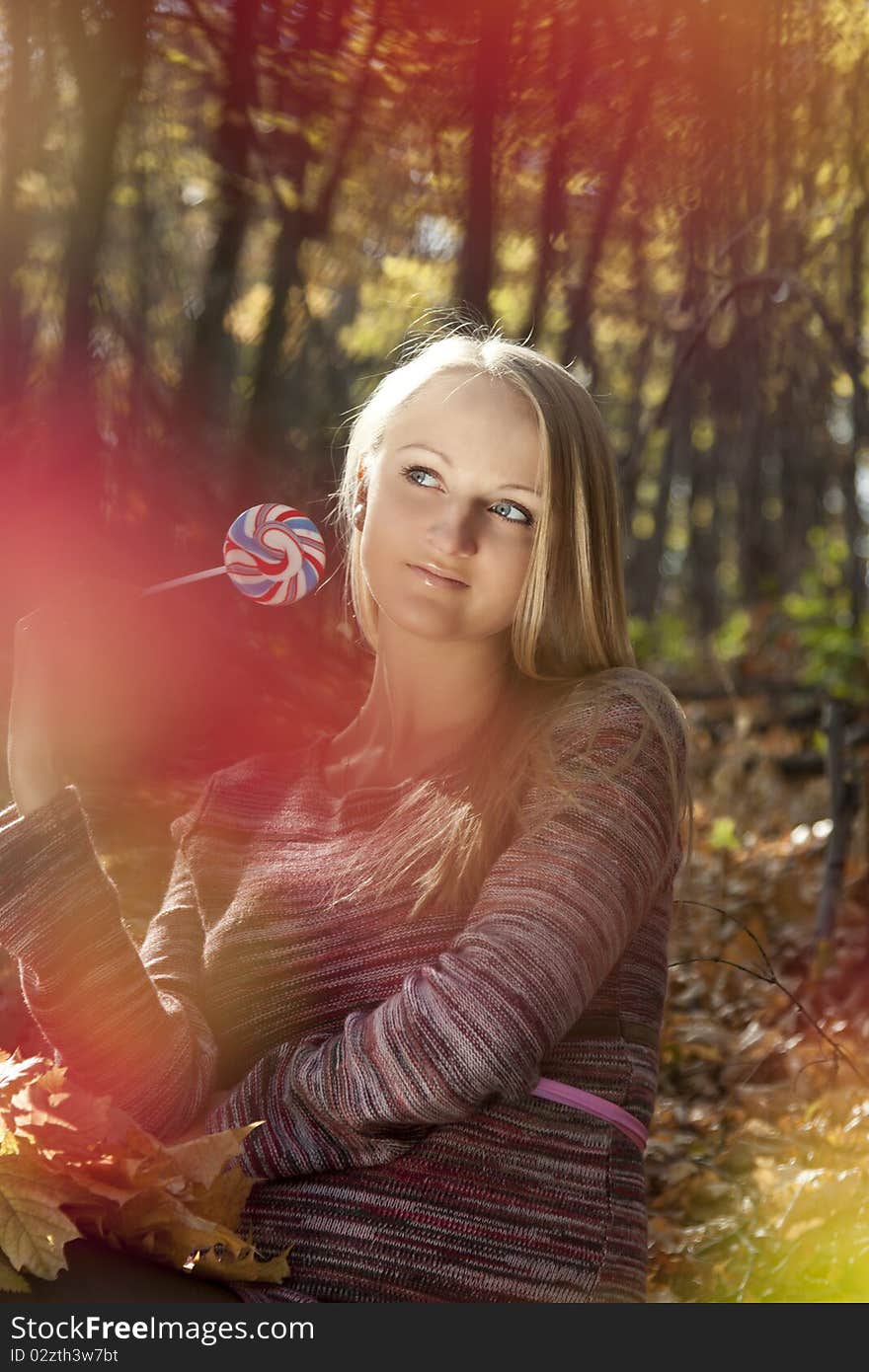 Woman eating candy lollipops