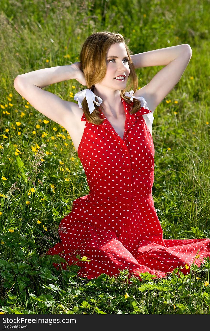 Beautiful model in field of flowers