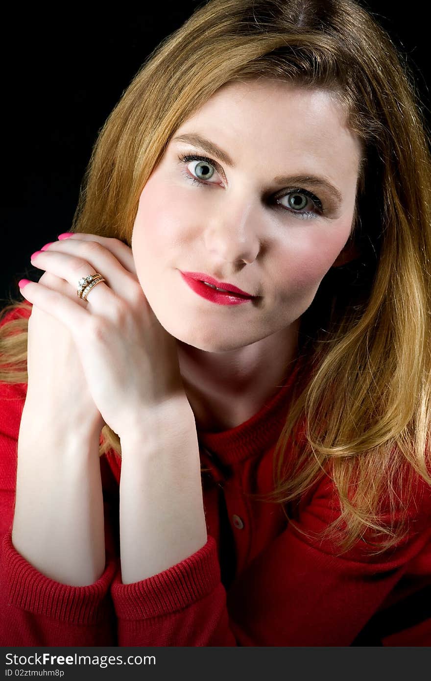 Head shot of beautiful model wearing red sweater