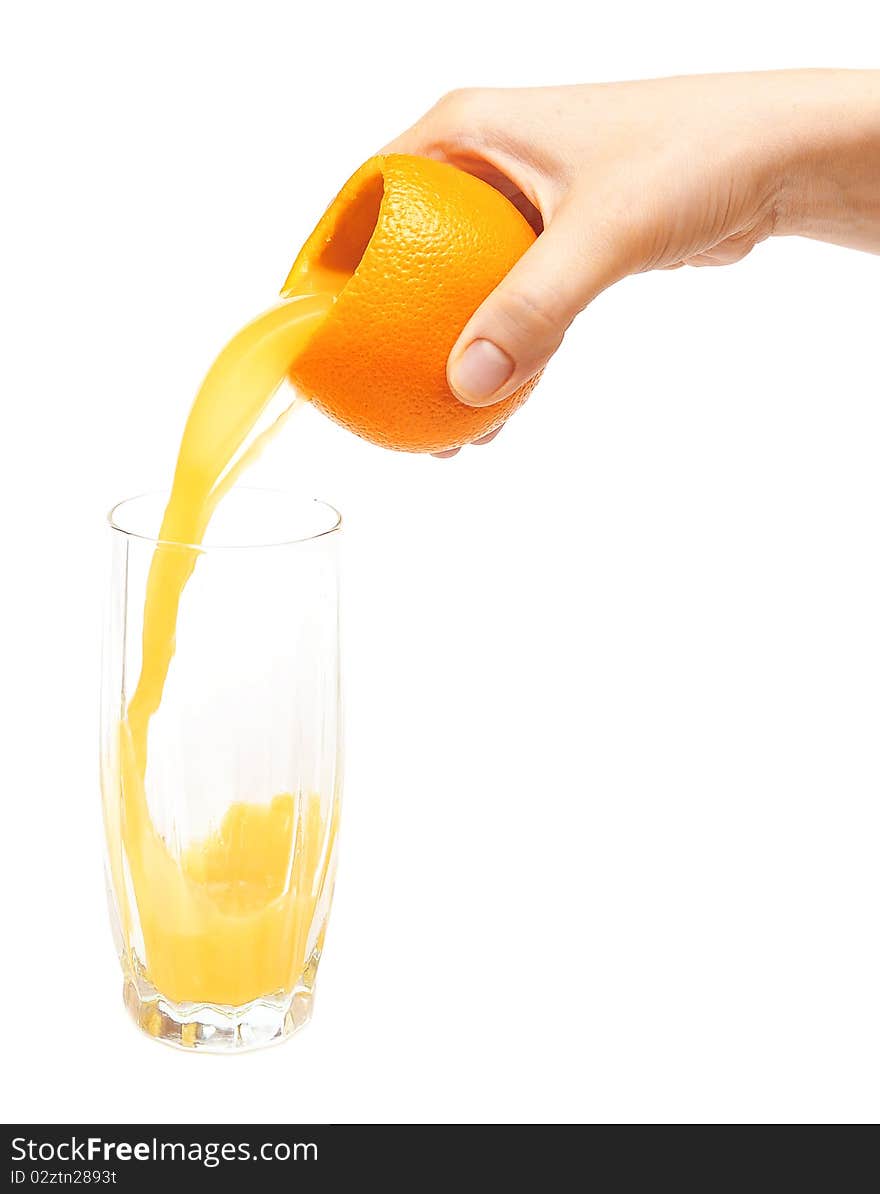 Fresh squeezed pouring orange juice isolated on a white background. Fresh squeezed pouring orange juice isolated on a white background