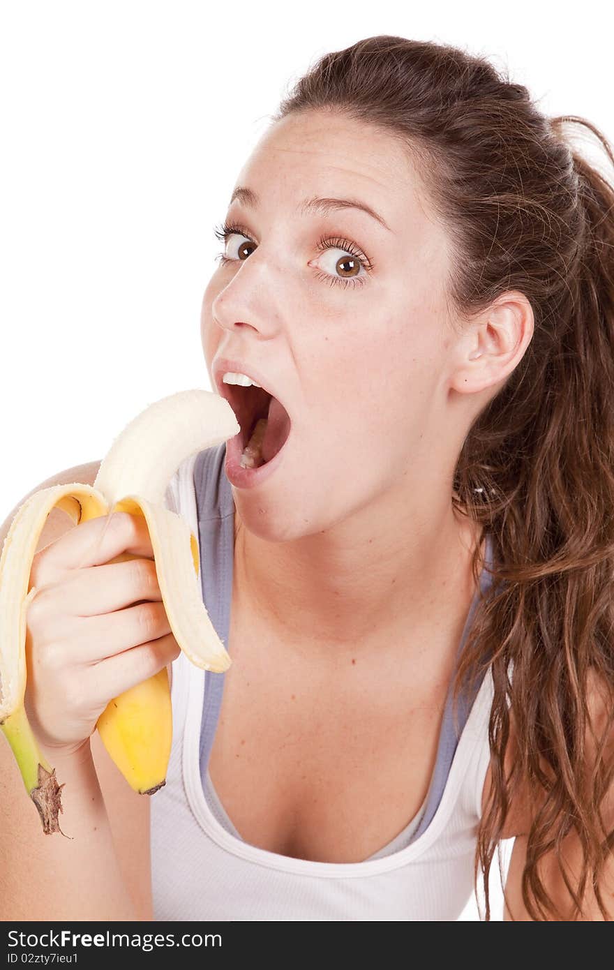 A woman is eating a banana and happy about it. A woman is eating a banana and happy about it.