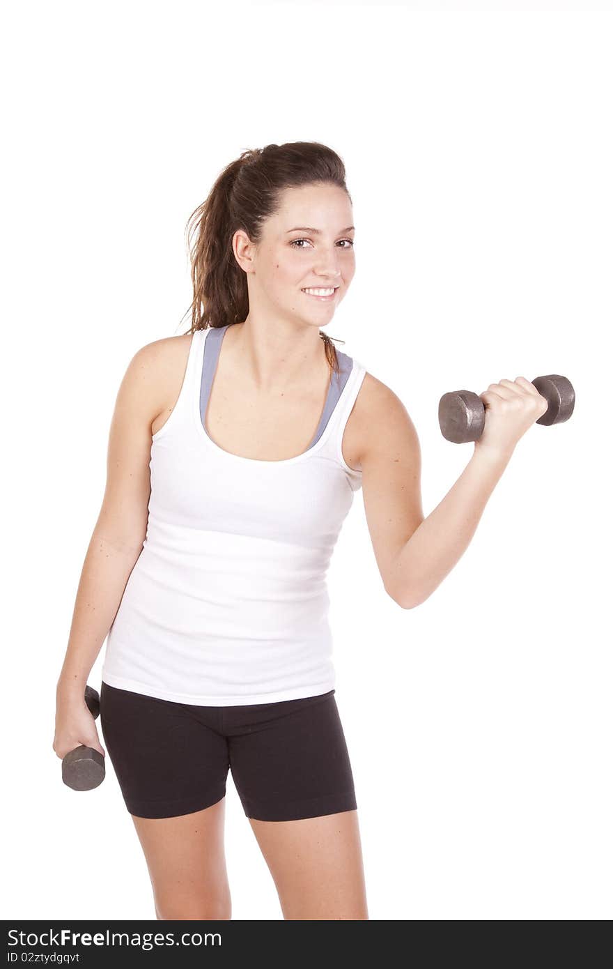 A woman is lifting some weights and wearing shorts and a tank top. A woman is lifting some weights and wearing shorts and a tank top.