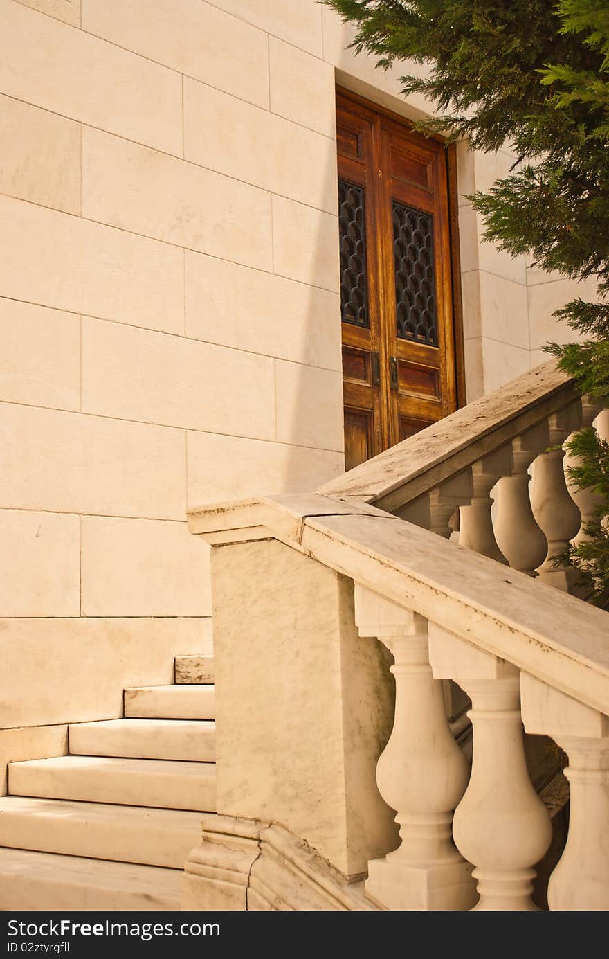 Wooden set of doors at the top of the stairs. Wooden set of doors at the top of the stairs