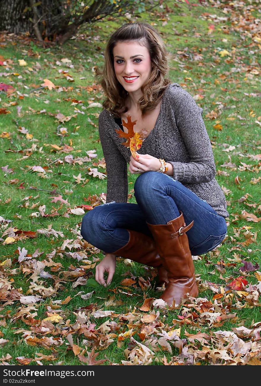 Happy young woman in autumn setting