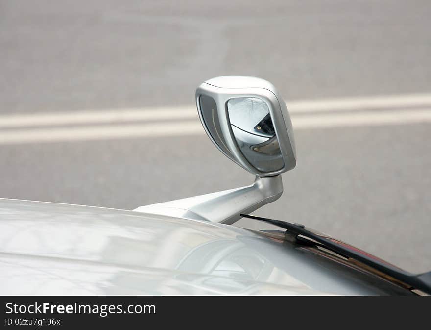 Automobile rear-view mirror attached on a cowl