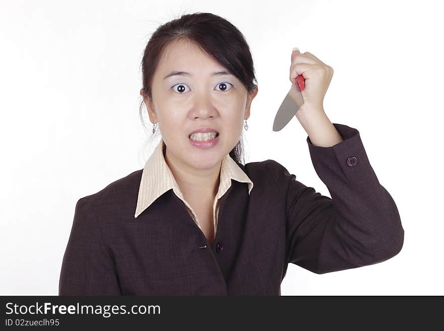 An angry Asian businesswoman holding a knife. An angry Asian businesswoman holding a knife