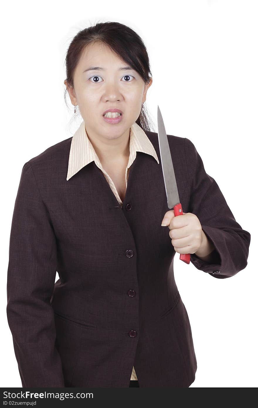 An angry Asian businesswoman holding a knife. An angry Asian businesswoman holding a knife