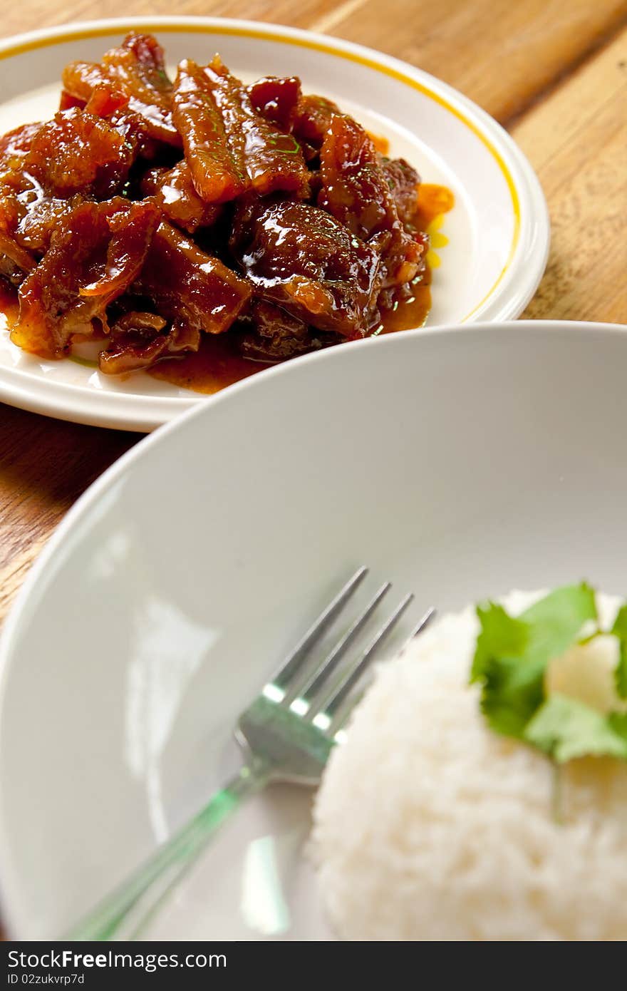 Roast pork with rice on wood background,thai food. Roast pork with rice on wood background,thai food.