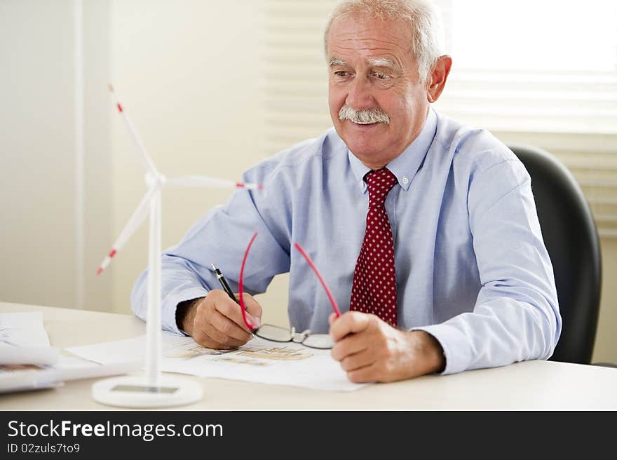 Senior eco engineer projecting new areas with wind turbines