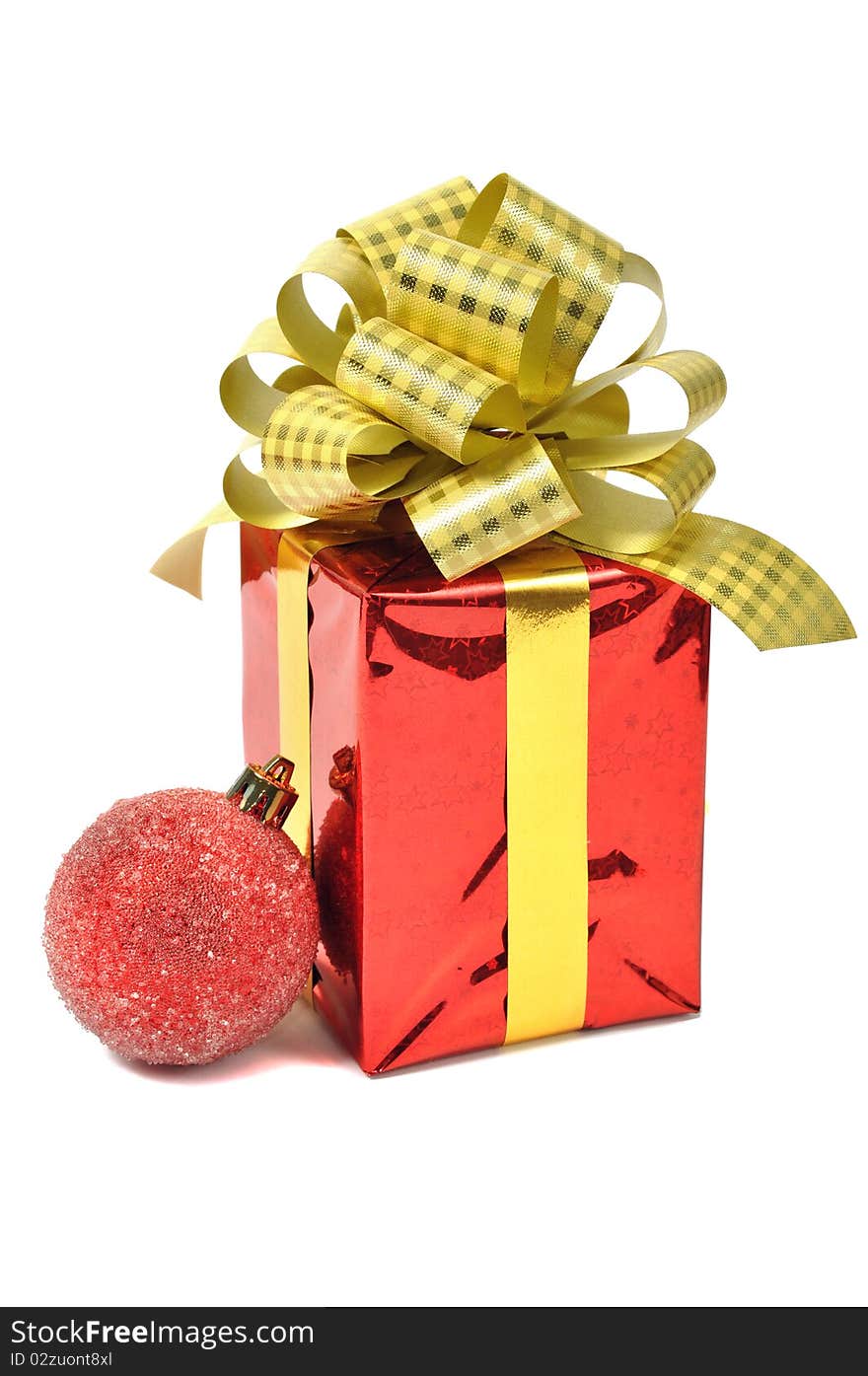 Red gift with ball over white. Red gift with ball over white