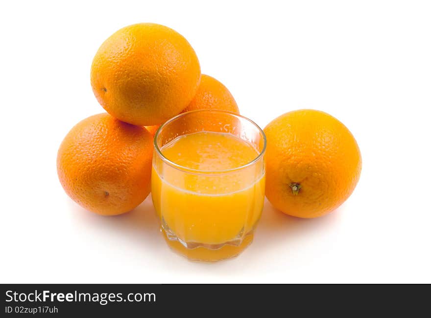 Orange juice and orange fruit on white