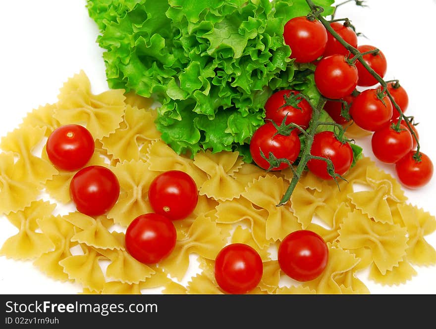 Macaroni and tomatoes on white background. Macaroni and tomatoes on white background