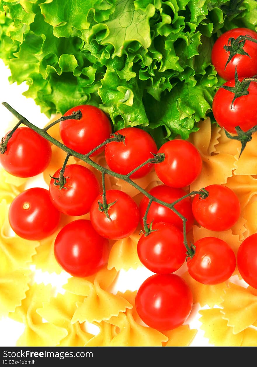 Macaroni and tomatoes on white background. Macaroni and tomatoes on white background